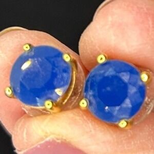 Blue Round stud earrings faceted stone set‎ in four prong Gold tone metal